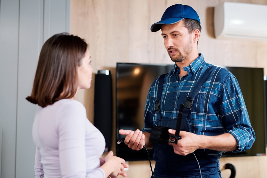hvac-technician-explaining-issue-to-client.jpg