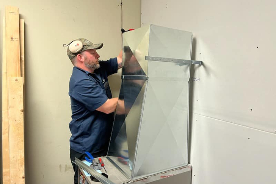 hvac-technician-learning-how-to-install-ducts.jpg