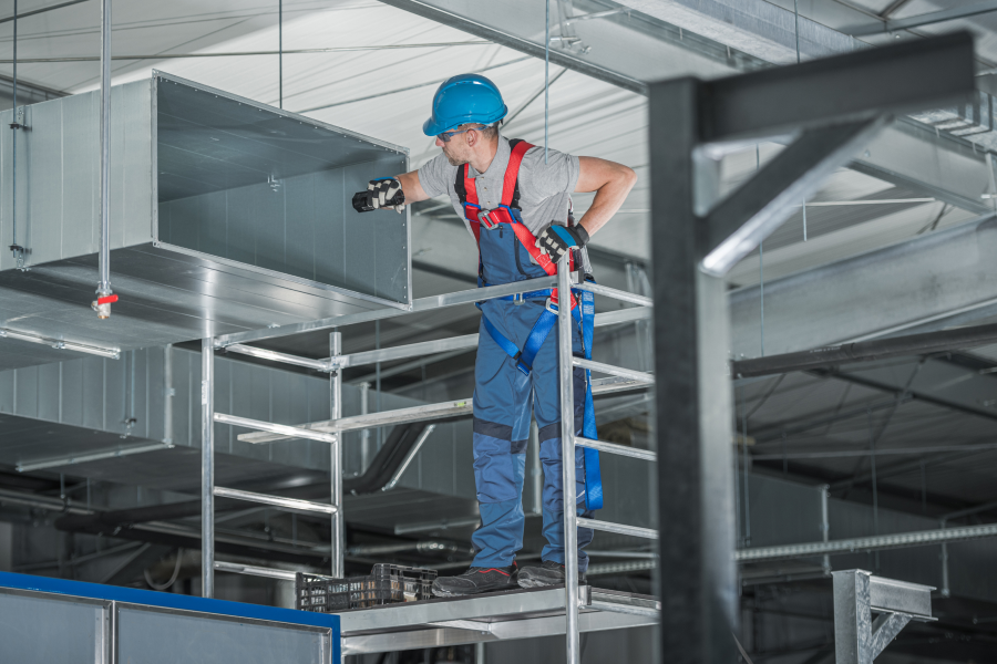 hvac-worker-looking-inside-air-duct.png