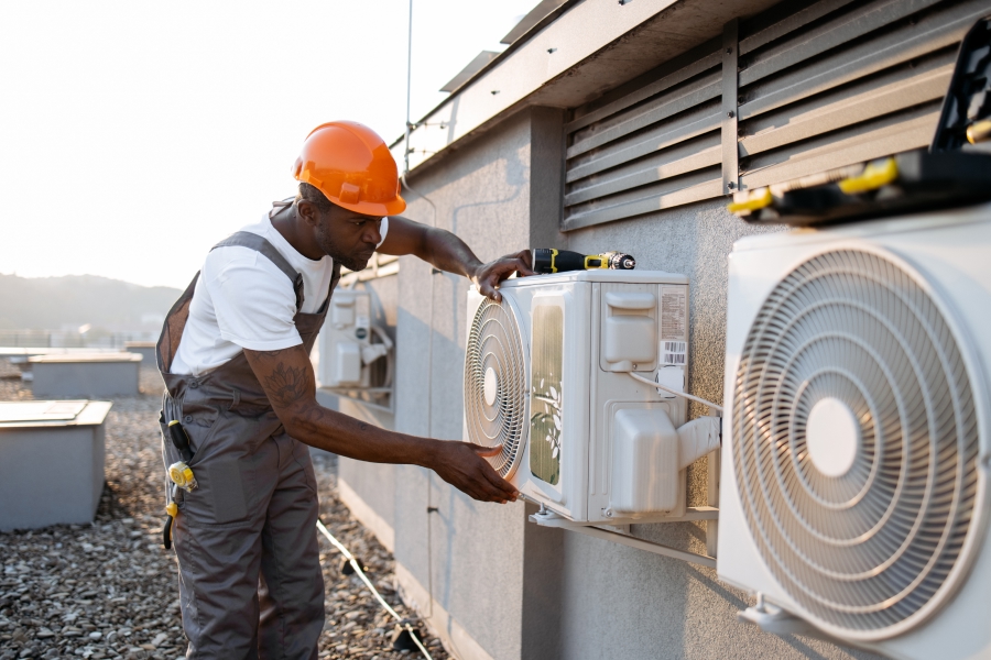 skilled-hvac-technician-checking-air-conditioner.jpg